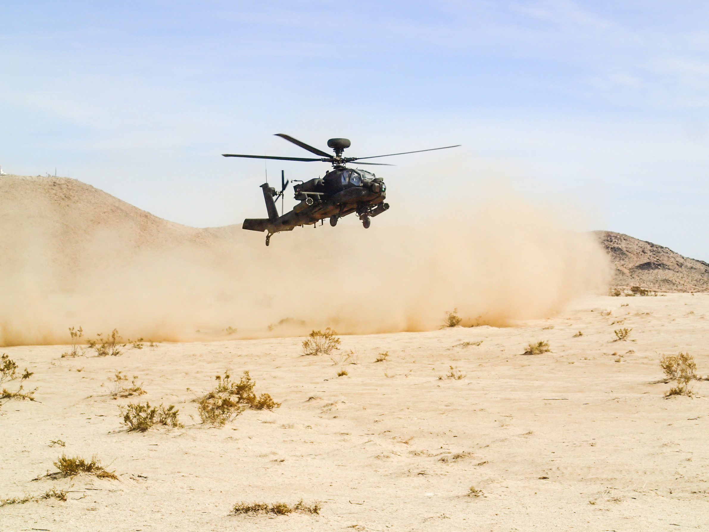 Apache Helicopter Landing in Desert